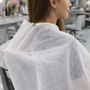 Capa peluquería desechable blanco